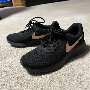 Like new black nike with gold check